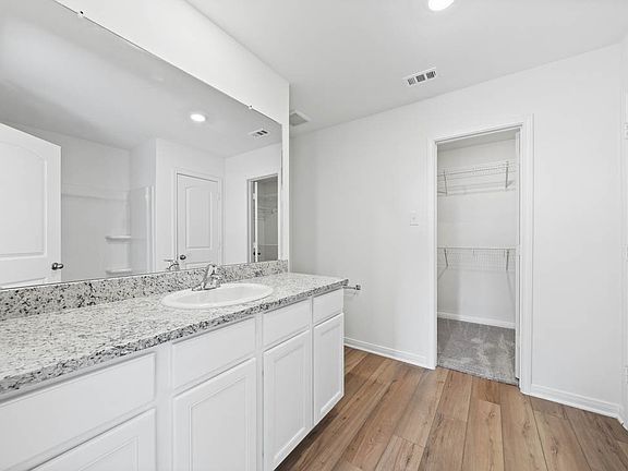 The spacious vanity in the master bathroom adds additional space perfect for getting ready each day