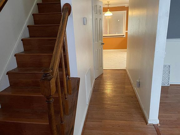 View from Entryway down center hall to Eat in Kitchen