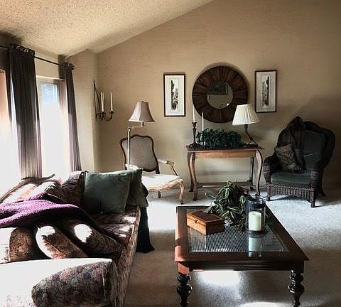 Enter front door- living room (carpet) w vaulted ceiling , excellent lighting.