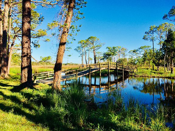Includes bridge over pond 