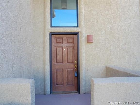 Covered front porch entry with room for a small table and chairs
