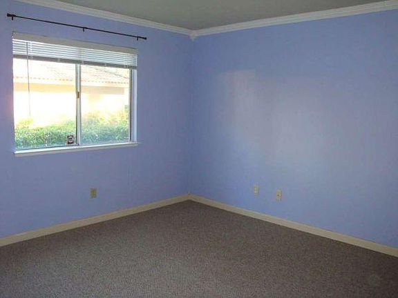 Front room with window, providing natural light.