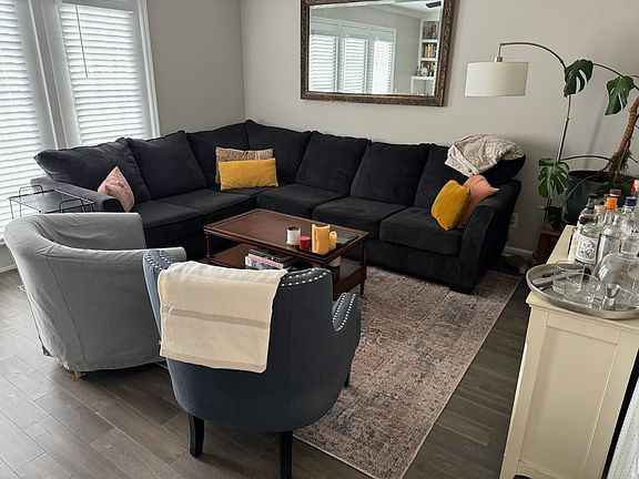 Den with large window overlooking patio
