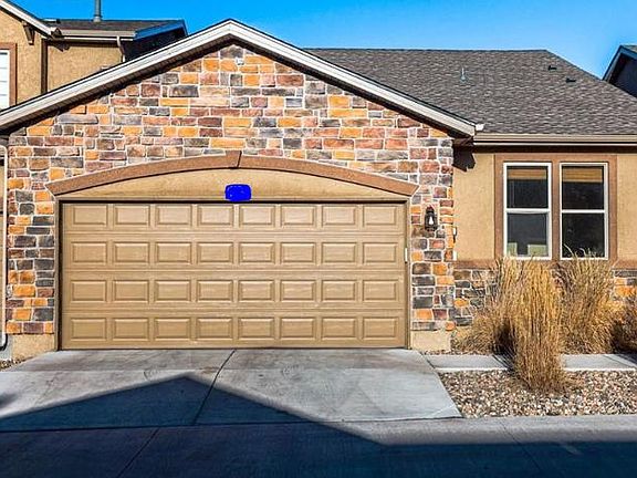 Garage with driveway that faces south