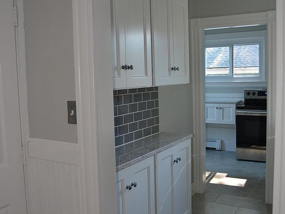 You will love this updated kitchen. Classic subway tiles with a modern flare !