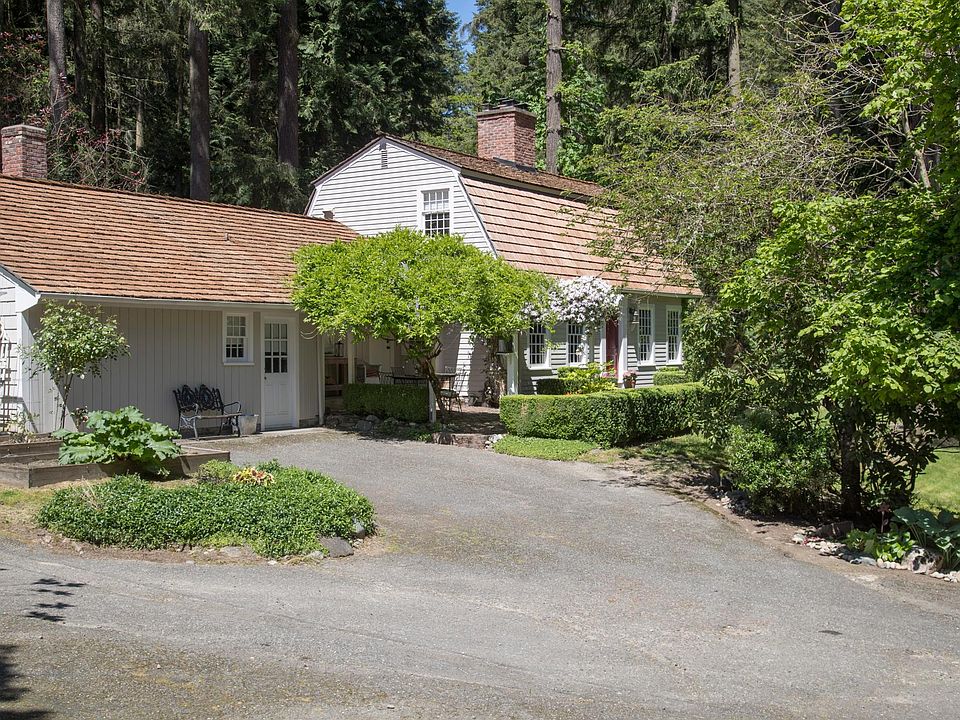 Main house and edition from front; detached two-car garage with inlaw apartment is off screen to right.