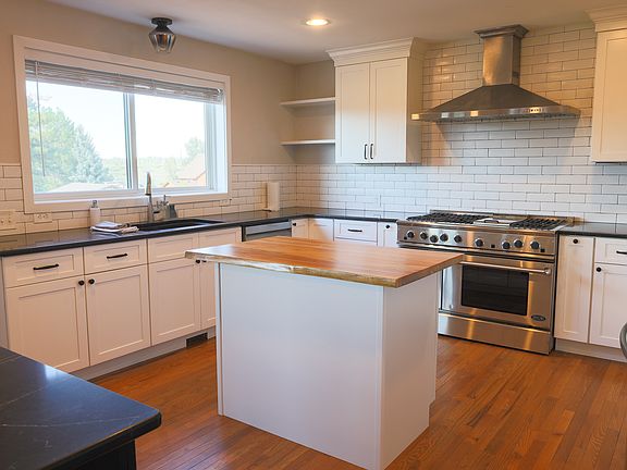 Updated kitchen, with large gas range.