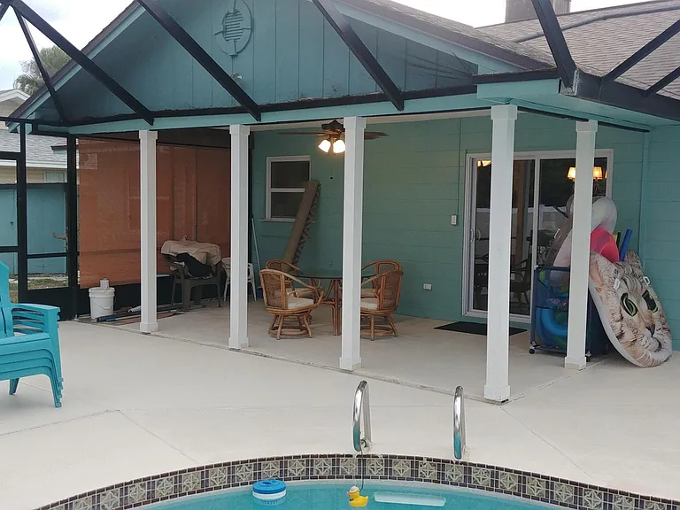 Interior screen room removed allowing free flow to the pool.