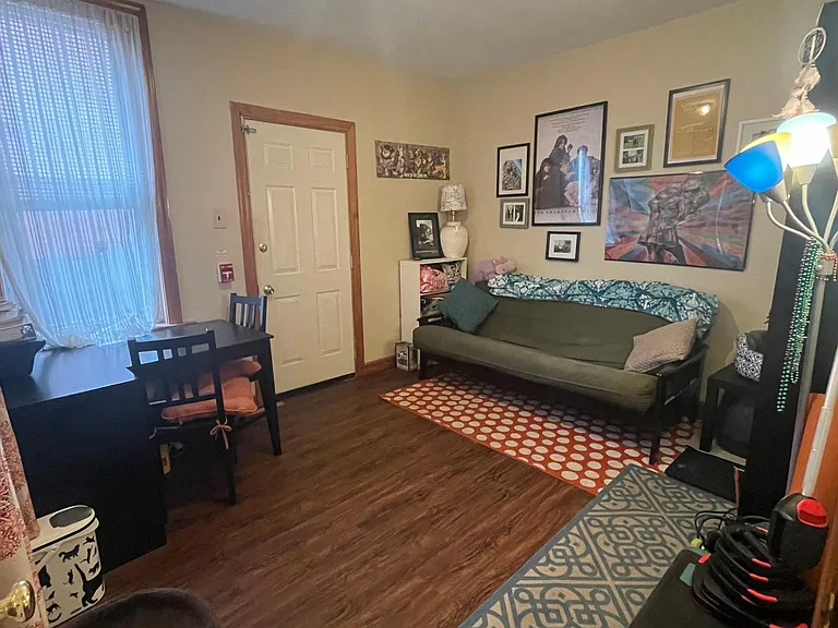 Back bedroom with access to private fenced in yard.