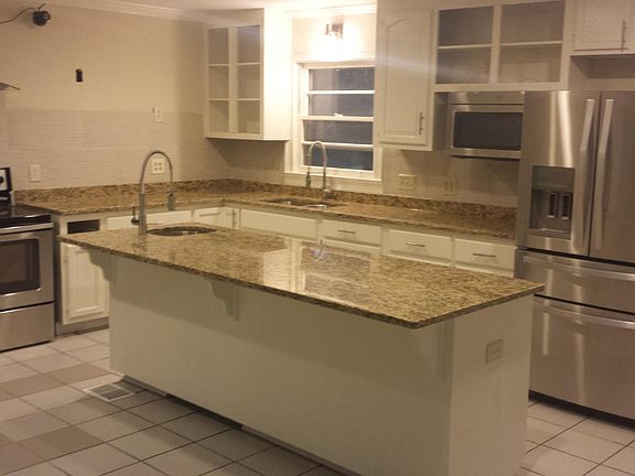 kitchen with all stainless appliance set, electric range , microwave double sinks, granite counter-tops, professional faucets