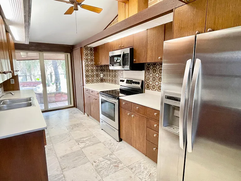 Bright kitchen with stainless appliances