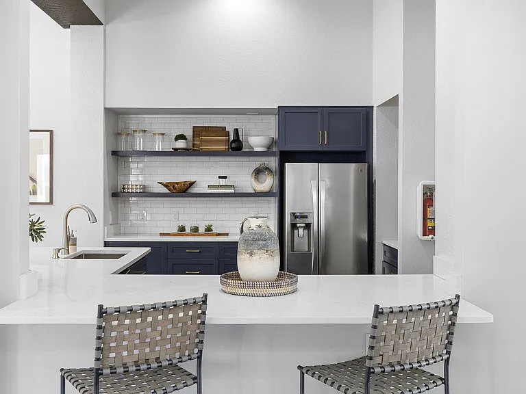 Clubroom kitchen with stainless appliances, ready for hosting gatherings
