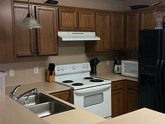 Kitchen is open to den .