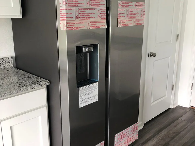 New 27.4 cu.ft side by side door Samsung refrigerator with water and ice(cubed and crushed) dispenser.
