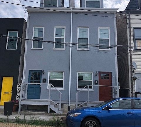 4 Rickenbach is the property on the left with the blue door