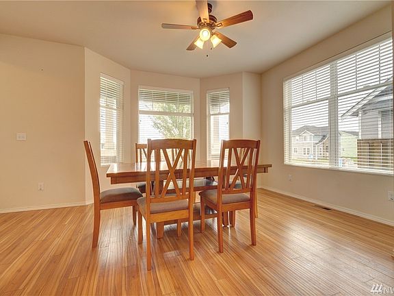 Dining room with bay window opens to the kitchen and is perfect for entertaining.