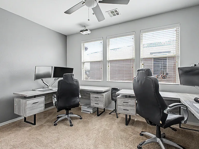 The upstairs office offers a versatile space that can also be used as a loft or additional living area. It features a projector with a retractable screen, making it ideal for work, entertainment, or family movie nights.