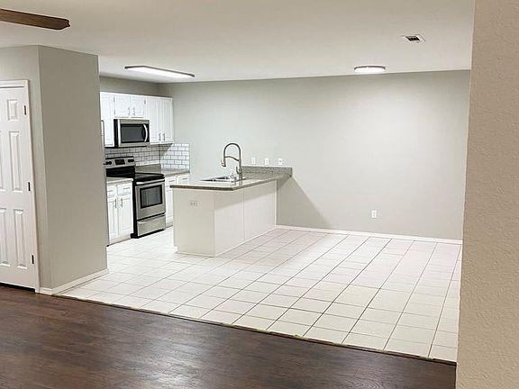 Living room transition into dining room and kitchen