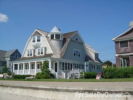 Rear of House
						:
						View of the house, including the 3rd floor turret, and seawall from the beach