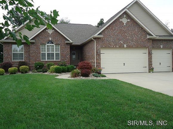 Brick front w  3 car garage