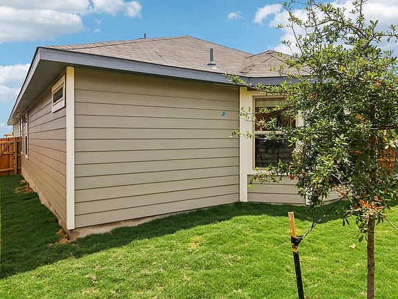 Back exterior of the Hughes floorplan at a Meritage Homes community.