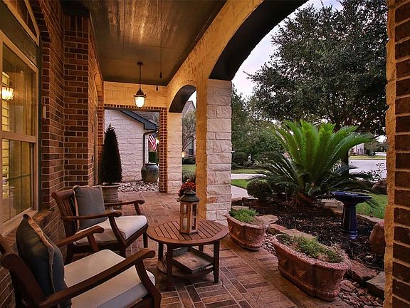 Relax and enjoy the neighbors on the extensive covered front porch