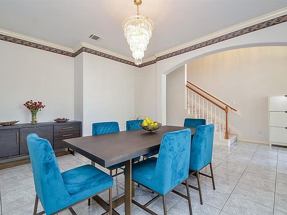 Dining room to the left of the entry is large and perfect for dinner parties.