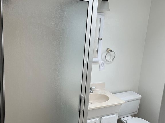 Bathroom with stall shower.