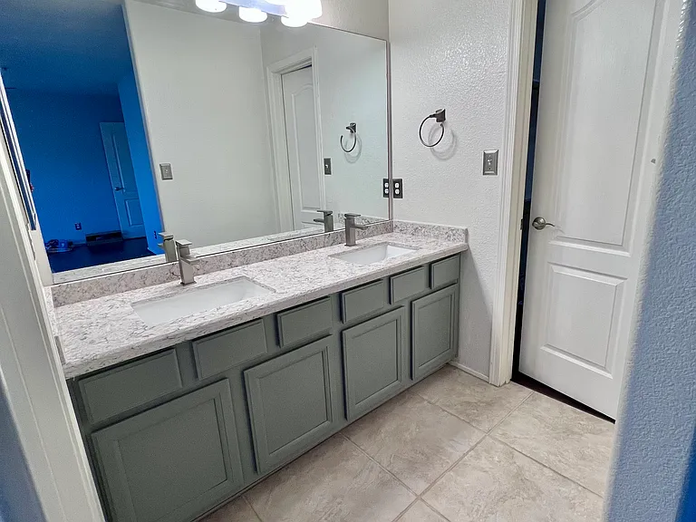 Master bedroom bathroom has double vanity, quartz countertop. New bathroom faucets in July 2026!