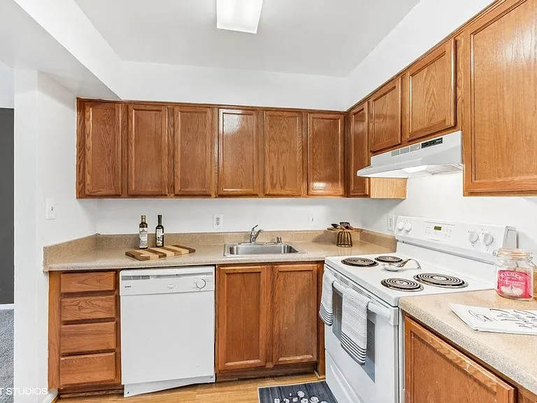 Fully Equipped Kitchen with White Appliances