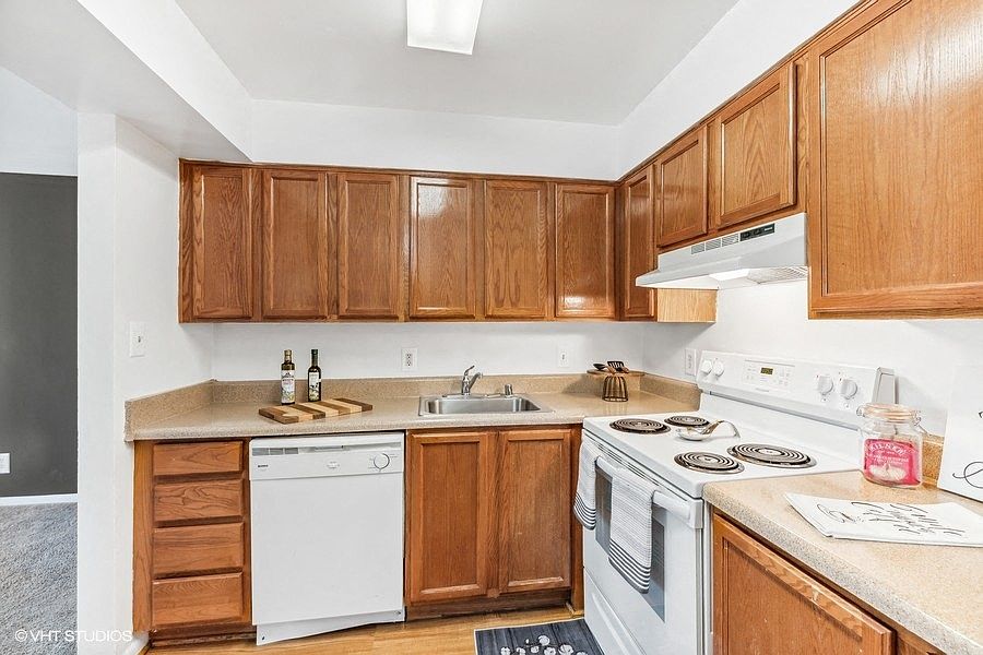 Fully Equipped Kitchen with White Appliances