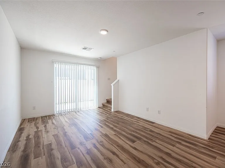 Living room: Bright open-concept living area with modern flooring.