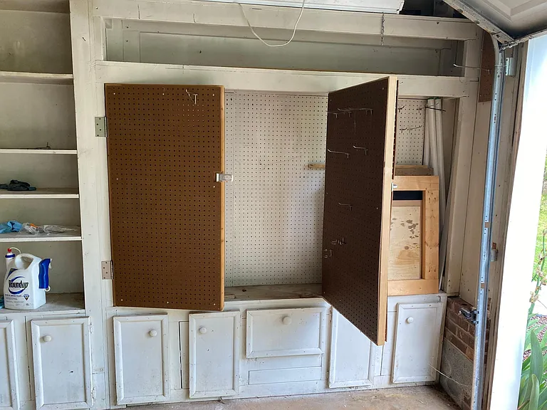 Pegboard storage locker in garage.