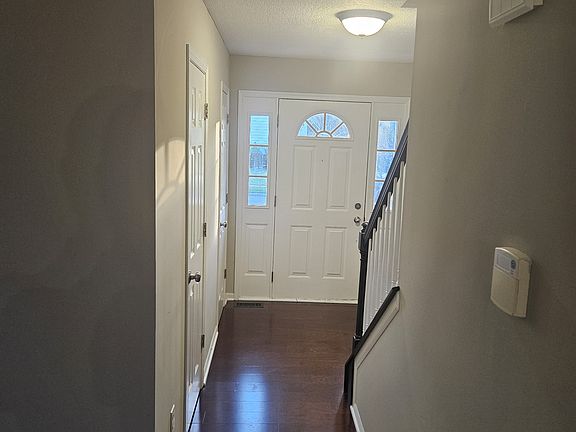 Hallway leading to the front door has guest bathroom and guest closet on the left. Whole house has available security system, and fire alarms.
