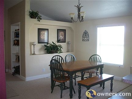 View of kitchen with built in bookshelf