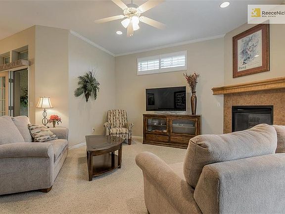 Warm and cozy living room showing the entrance to the sun room.