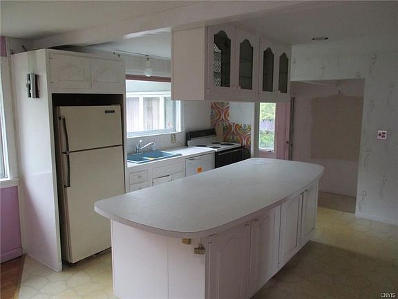 Kitchen  area has a large center island and all appliances.