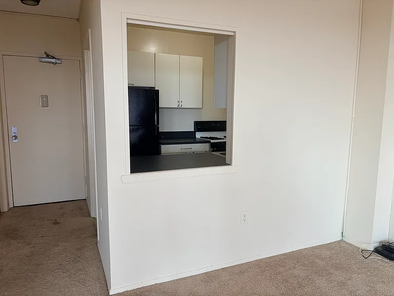 Interior photos taken before new carpeting and fresh paint.
