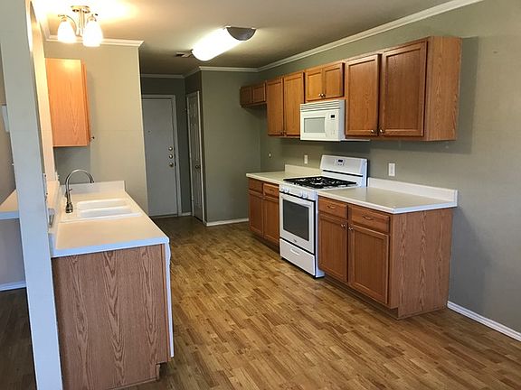 Laundry Room next to the garage in kitchen with lots of storage room.