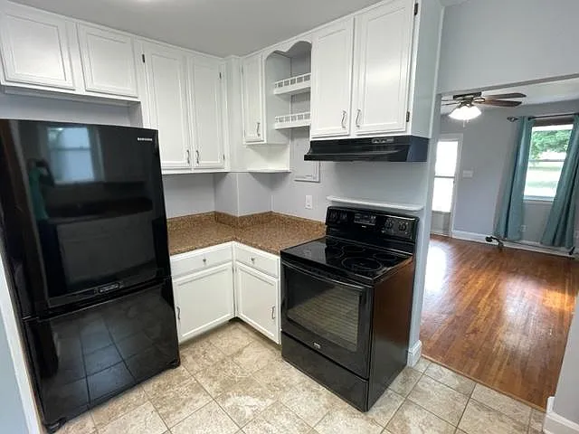 Kitchen and view of family room