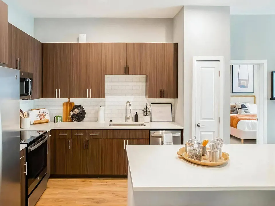 The island doubles as a breakfast bar and still leaves prep space.