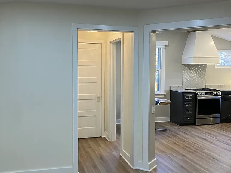 View from Living Room into hall with bath & pantry -- Kitchen