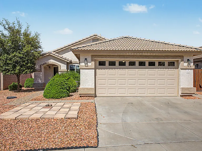 Front entrance and 2 car garage.
