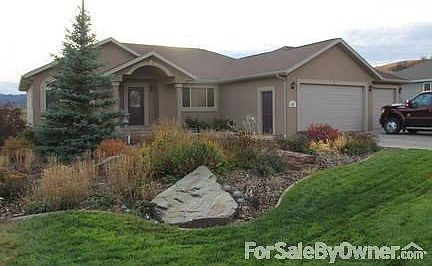 Front
						:
						Extensive landscaping. Garden in fall after first freeze.