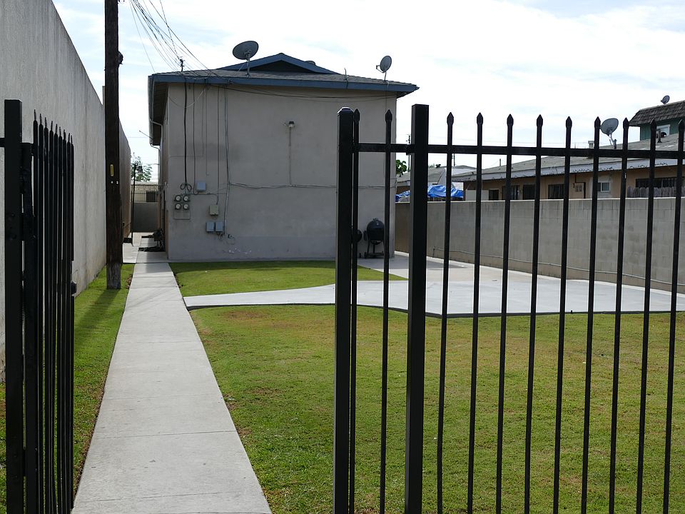Big yard, fenced space, security cameras and wrought iron fence