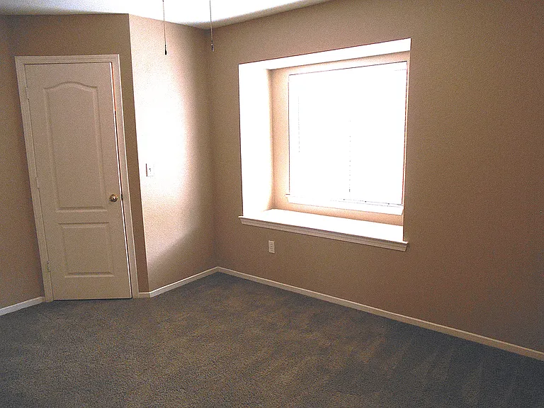 Guest Bedroom with Window Seat and Walk-in Closet