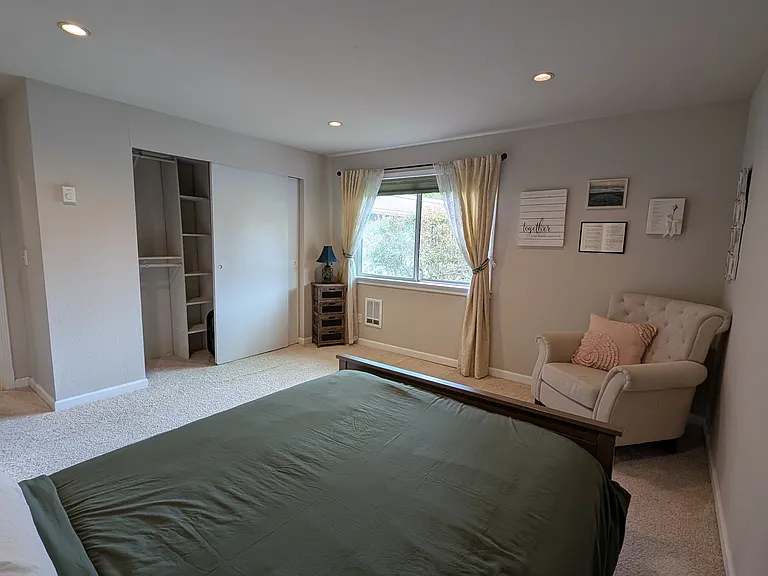 The bed in this image is a full size bed (54" x 75"), which is just a little smaller than a queen bed (60" x 80").