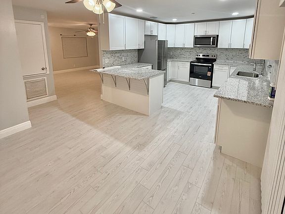 dining room view into kitchen and living room