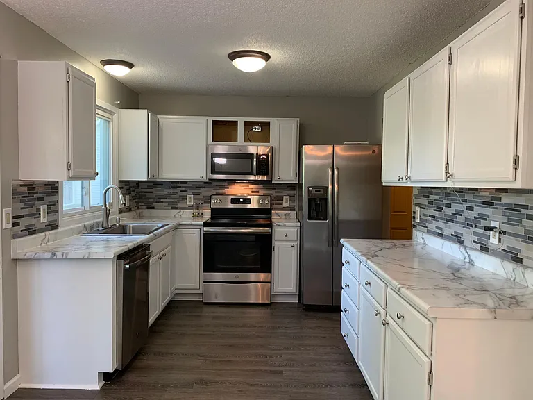 New renovated Kitchen, Newer (GE appliances, Backsplash tile, Sink and faucets)