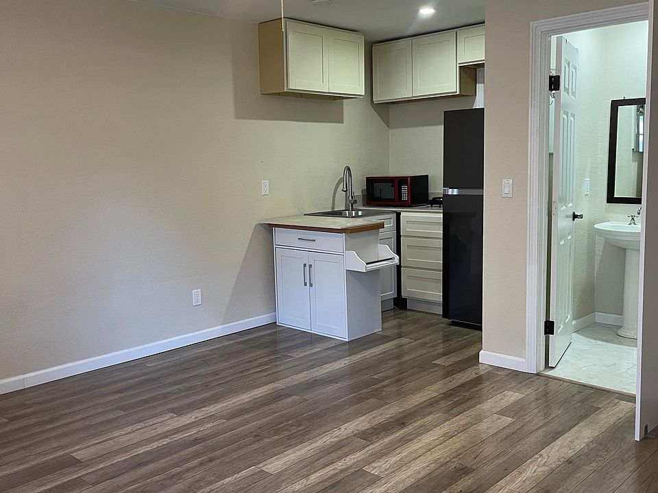 new laminate flooring with ceiling fan and LED in kitchen